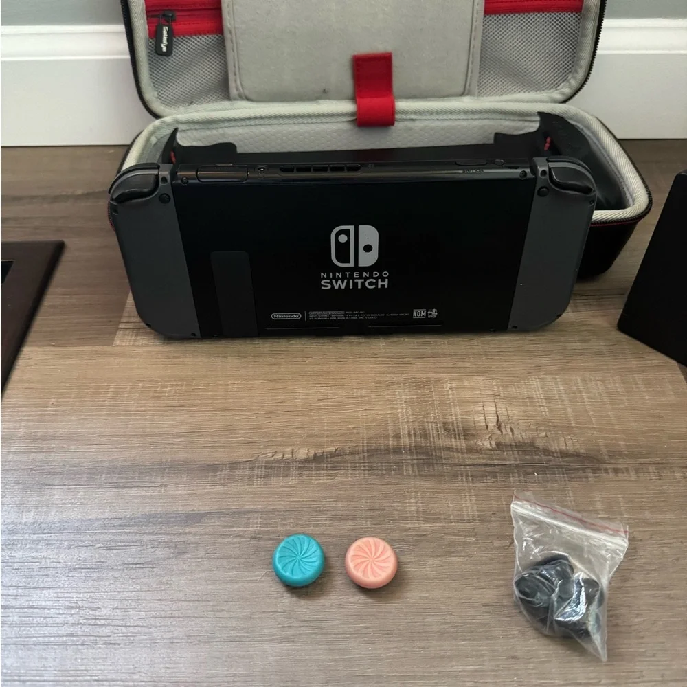 Nintendo Switch with Black and Gray Accessories